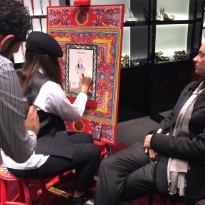 Painter and portraits in Dolce & Gabbana store